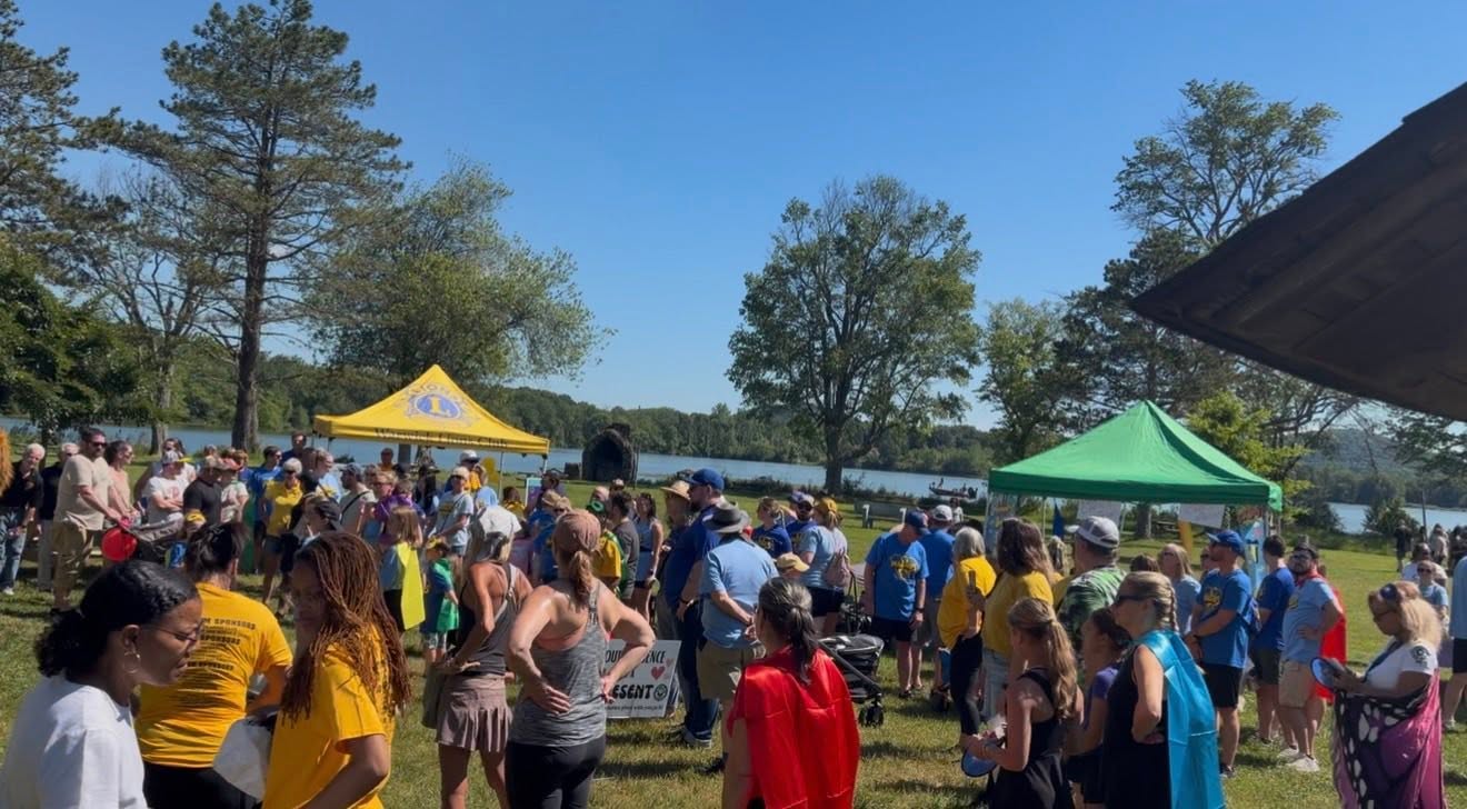 Crowd gathered lakeside at the walk