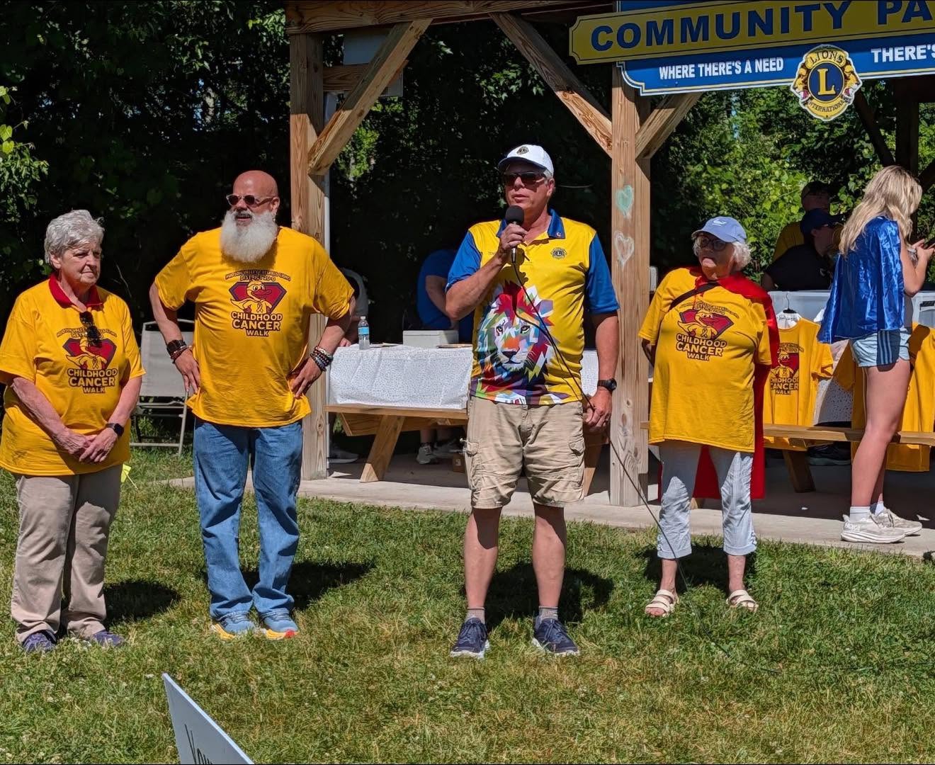 Members giving opening remarks into a microphone