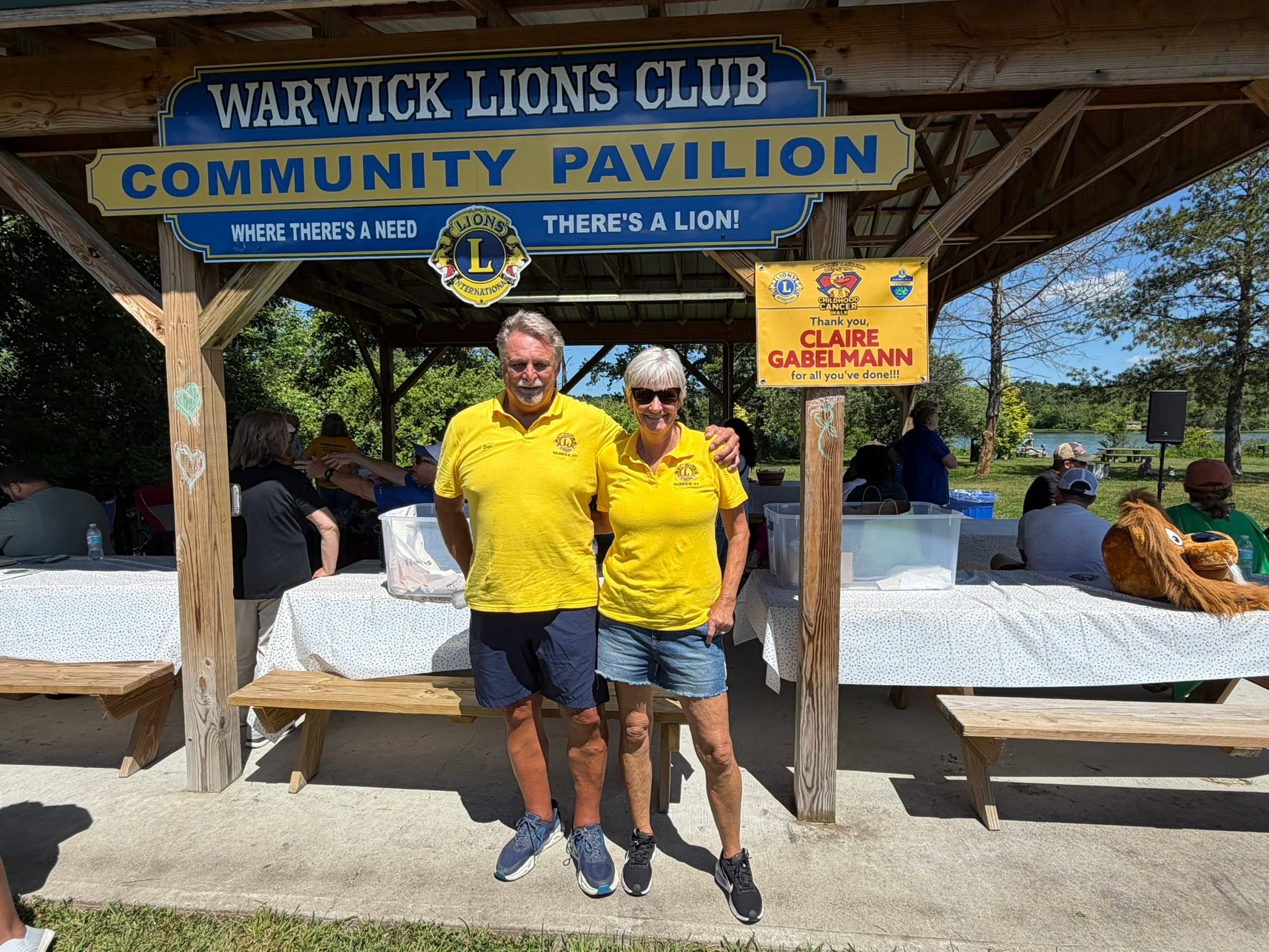 Couple in yellow Lions shirts at the Community Pavilion