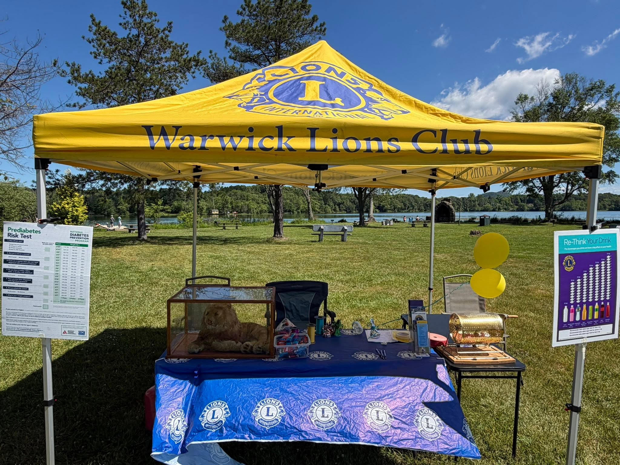 Warwick Lions Club tent with information table